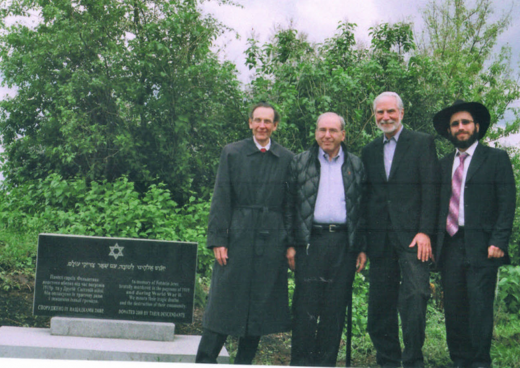 Felshtin memorial dedication ceremony, May, 2010. Standing alongside the memorial, from left to right, Sid Shaievitz, Alan Bernstein, Mel Werbach and Rabbi Yehoshua Raskin.