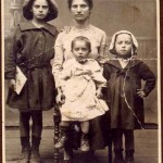 SHIRLEY KELLENSON, FELSHTIN ORPHAN, (standing, with mother and sisters in Felshtin).